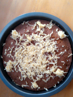 A picture of Mango Cake with Cheese on Top.