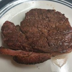 A picture of Fillet Mignon wrapped in Applewood Bacon.