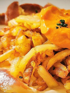 Una foto de Patatas fritas con Paletilla ibérica salteada