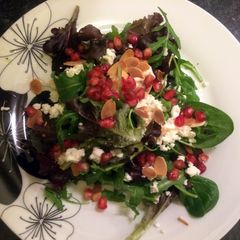 A picture of Pomegranate baby leaf rocket salad.