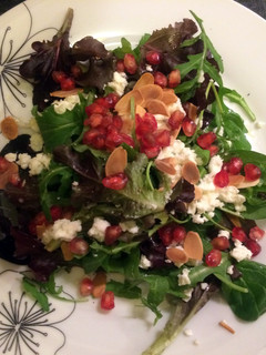 A picture of Pomegranate baby leaf rocket salad.