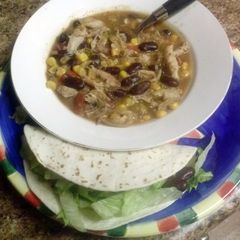 A picture of Shredded Mexican Chicken soup or Tacos.