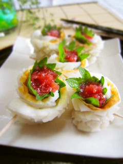 A picture of Refreshing Chikuwa Rolls with Umeboshi and Shiso Leaves.