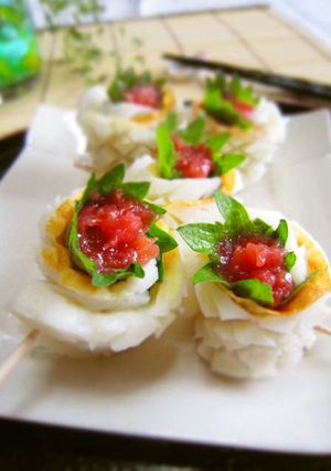 A picture of Refreshing Chikuwa Rolls with Umeboshi and Shiso Leaves.