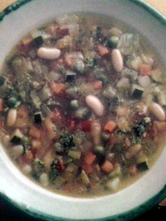 A picture of Minestrone with pesto.