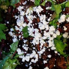 A picture of Mixed Greens, candied walnuts, feta &cranberry.
