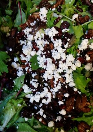 A picture of Mixed Greens, candied walnuts, feta &cranberry.