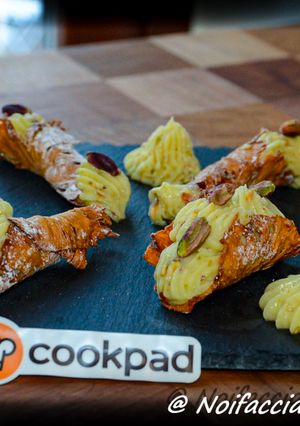 A picture of Finger Food - Pineapple Cannoli with White Chocolate Pastry Cream and Bronte Pistachios.