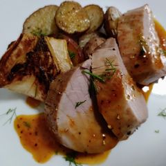 A picture of Pork tenderloin with orange and fennel sauce.