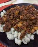 Ñoquis de perejil con Bolognesa