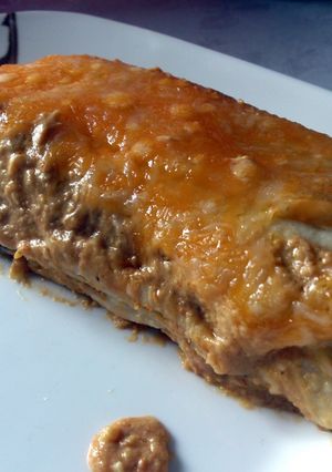 A picture of Chicken and avacado enchiladas in creamy avacado sauce.