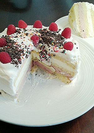 A picture of Butter Cake filled with Rasberry and Lemon Whipped Cream, with a Vanilla Whipped Cream Topping.