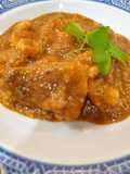 Suquet de rape, gambas roja y chipirón con picada de almendras y avellanas