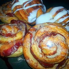 A picture of Bacon wrapped Cinnamon Rolls With maple mocha glaze.