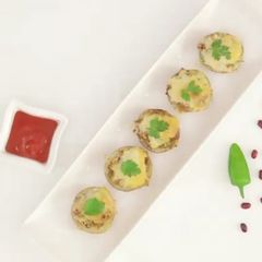 Cheesy Tandoori Bullet Potatoes A picture of Cheesy Tandoori Bullet Potatoes.