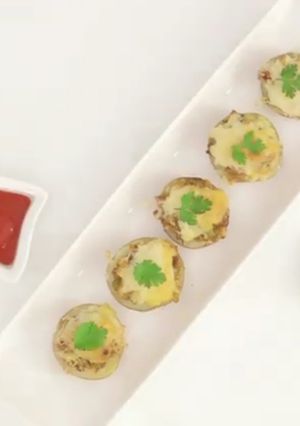 A picture of Cheesy Tandoori Bullet Potatoes.