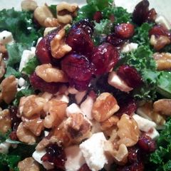 A picture of Kale salad with the fixings.