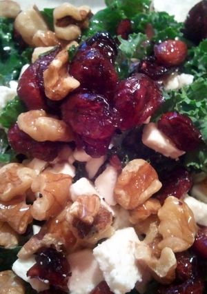 A picture of Kale salad with the fixings.