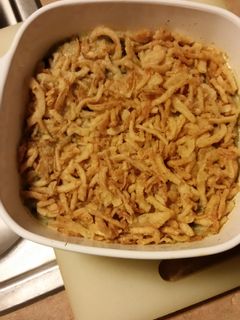 A picture of Spinach casserole with alfredo sauce.