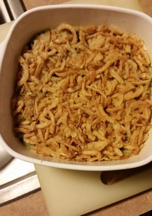 A picture of Spinach casserole with alfredo sauce.