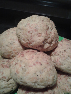 A picture of Cheese breads with basil.