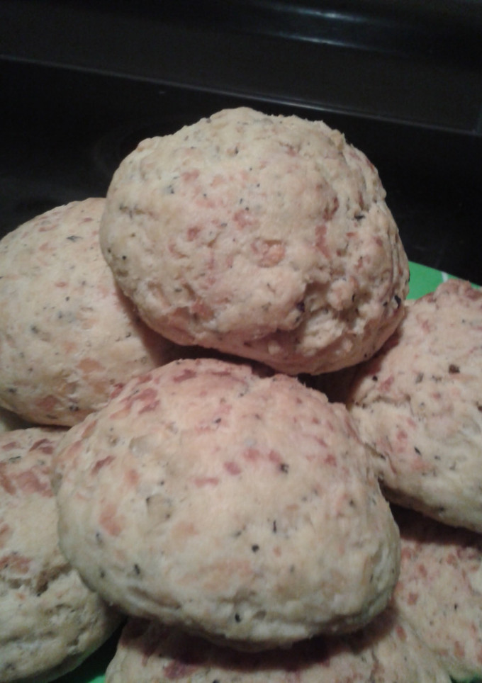 A picture of Cheese breads with basil.