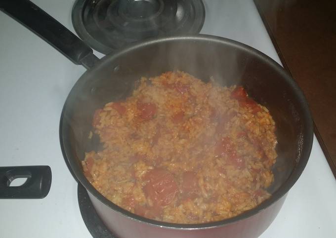 Step-by-Step Guide to Prepare Speedy Spicy yellow rice with diced tomatoes
