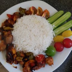 A picture of Chicken, veg grill with white rice.
