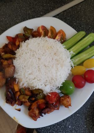 A picture of Chicken, veg grill with white rice.