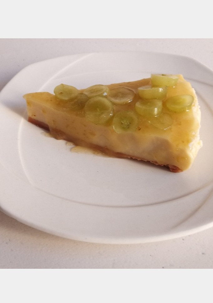 Una foto de Cheesecake con compota de uva