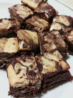 A picture of Orange Cheesecake Brownies.