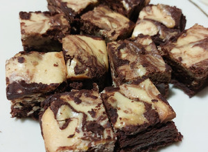 Una foto de Brownies de cheesecake de naranja