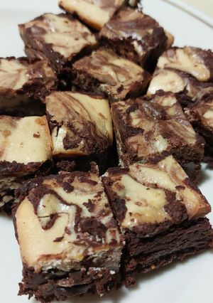 Una foto de Brownies de cheesecake de naranja