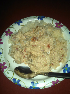A picture of Shredded chicken and rice.