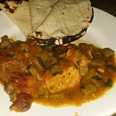 A picture of Nopales and pork stew.