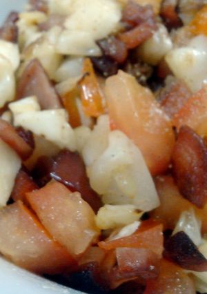 A picture of Fried Cabbage with sausage.