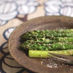 A picture of Asparagus Saute with Lots of Grated Cheese.