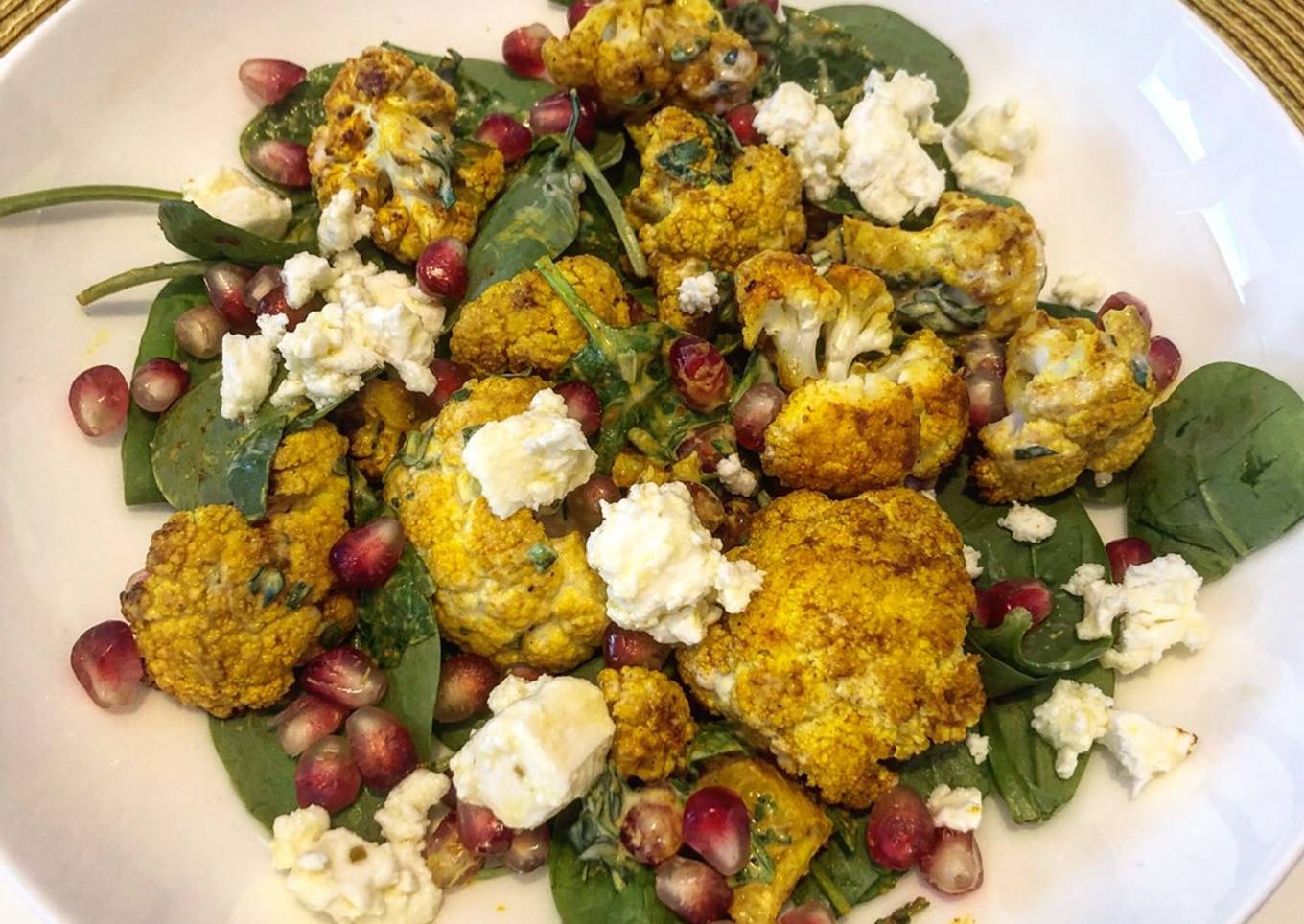 Turmeric roasted cauliflower salad with feta and zhoug style dressing