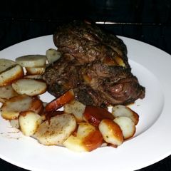 A picture of Lamb leg in oven.