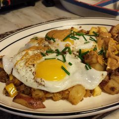 A picture of Chorizo Hash with Over Easy Eggs.