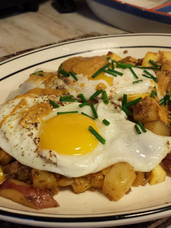 A picture of Chorizo Hash with Over Easy Eggs.