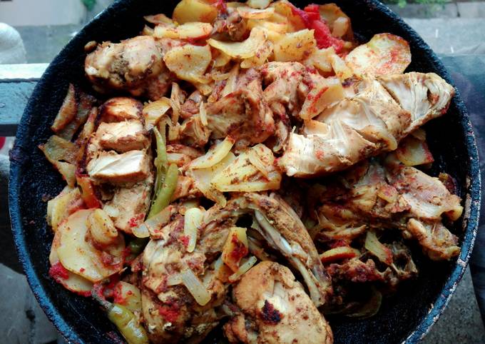Messy chicken roast in pan