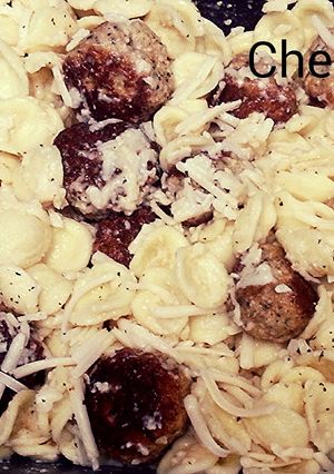 A picture of Orecchiette with mini chicken meatballs.