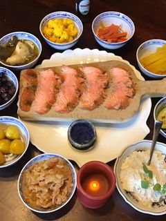 A picture of California Farm made Sour Cream, Cold Smoked Salmon and Potato Poffertjes.