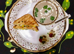 A picture of Cream of Mushroom Soup With Spinach-Methi Egg Sandwich.