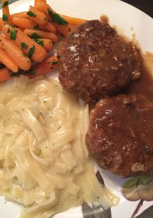 A picture of Mini Breaded Meatloafs In Gravy.