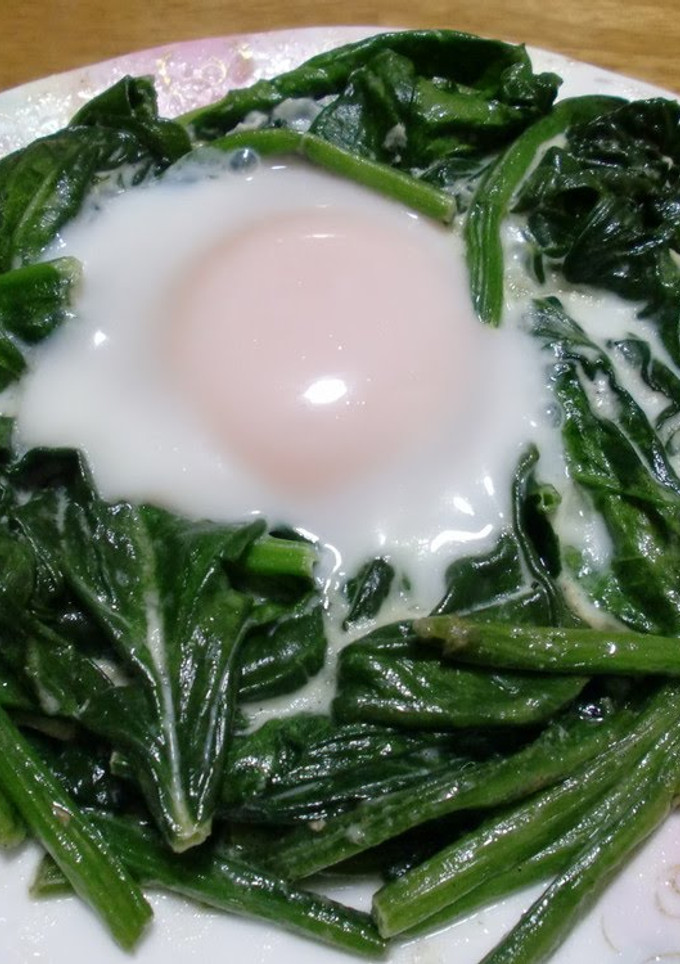 A picture of Eggs in a Nest of Spinach with Mayonnaise.