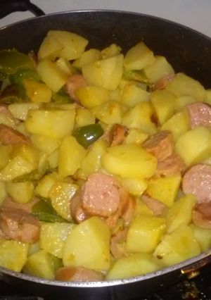 A picture of Fried potatoes and turkey sausage.