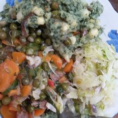 A picture of Mukimo, fried peas and steamed cabbage.