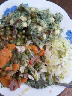 A picture of Mukimo, fried peas and steamed cabbage.